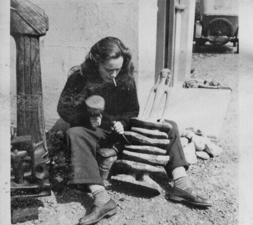 Hilary Heron carving Lady of the Rocks, 1953; image courtesy of IMMA and the Estate of Hilary Heron.⁠